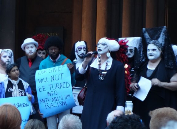 The Boston Sisters of Perpetual Indulgence lead a vigil on the West Porch of Trinity.