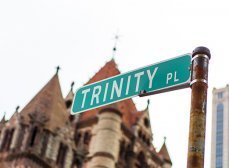 Road sign reading 'Trinity Pl' outside of Trinity Church Boston, an Episcopal church in the Back Bay neighborhood of Boston