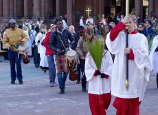 Acolytes and drummers lead the Palm Sunday procession.