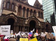 Protesters gather outside Trinity Church in Copley Square to support refugees and immigrants.