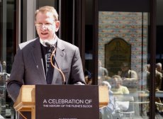 The Rev. Bill Rich recounted the Trinity's history in front of the new marker display.
